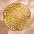 Assal zellige mosaic side table seen from above, tumbling diamonds in mustard, honey and straw yellow with a mustard and white border, colour rendering of the design