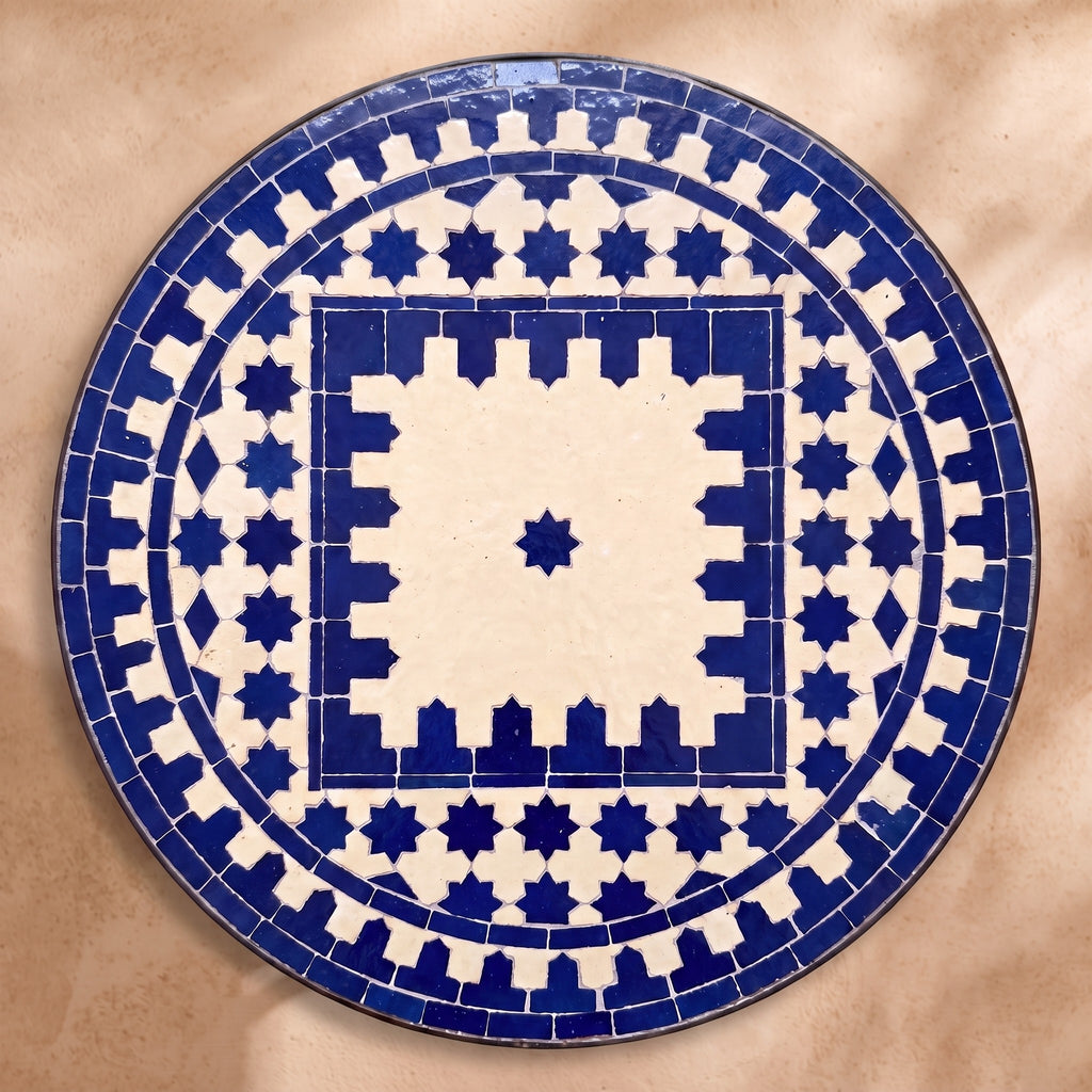 Bhar zellige tabletop seen from above, Salé friezes and star ring in navy on cream