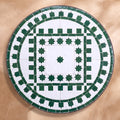 Ghaba zellige tabletop seen from above, Salé friezes and star ring in green on white