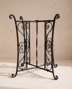 The ornamented wrought iron base option, hand-forged scrollwork on the lower part, painted matte black, +€25 on Ø50 and Ø60 at 55 cm.