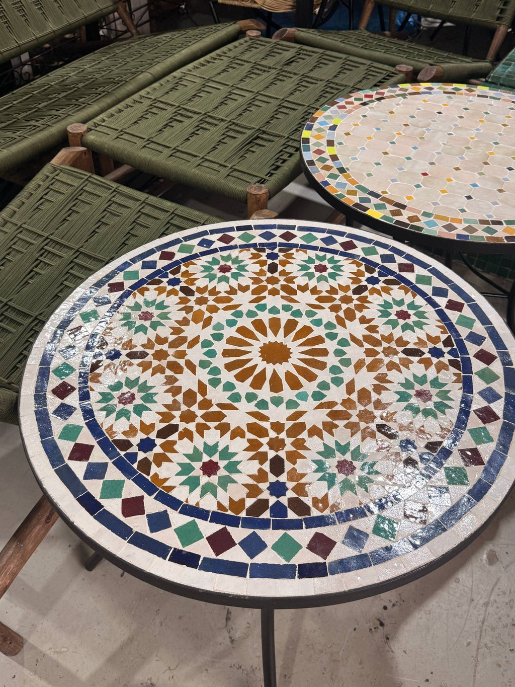 Close view of the Kawkab zellige top, hand-cut green, navy and burgundy pieces