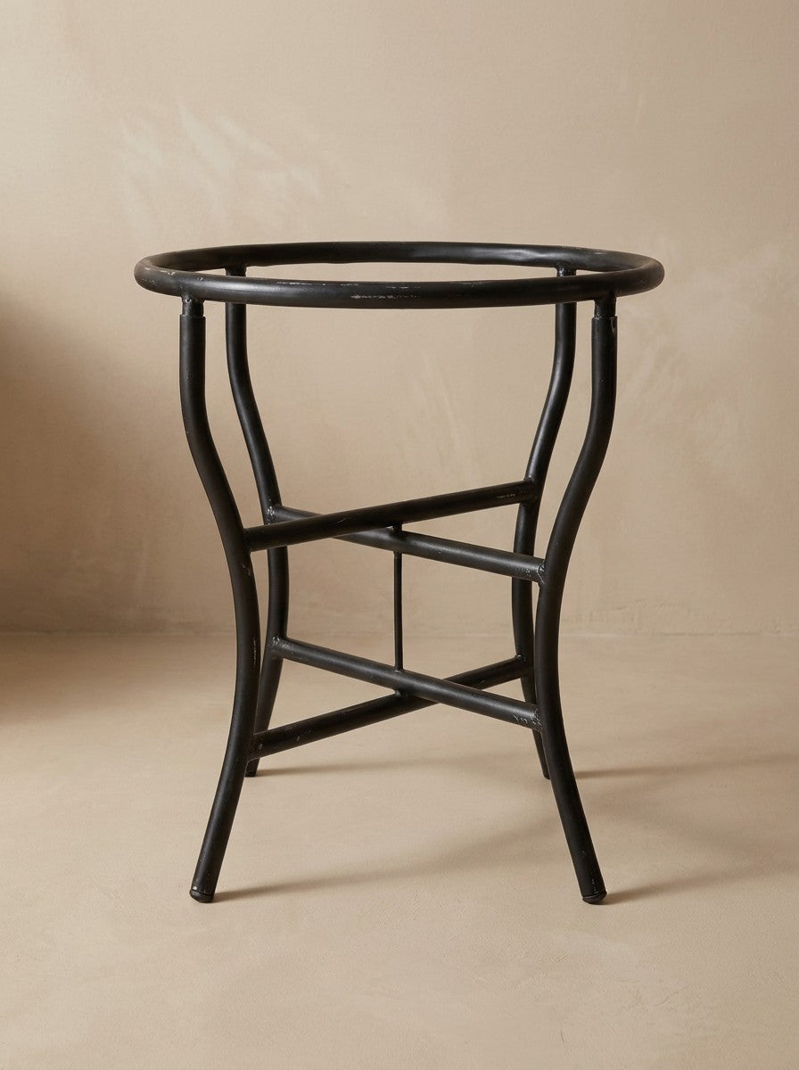 The curved folding wrought iron base that comes with the table, round tube painted matte black, included in the price.