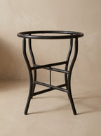 The curved folding wrought iron base that comes with the table, round tube painted matte black, included in the price.