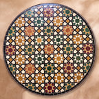 Meknassia zellige tabletop seen from above, warm red, ochre and green stars outlined in black strips on cream, inspired by Meknès embroidery