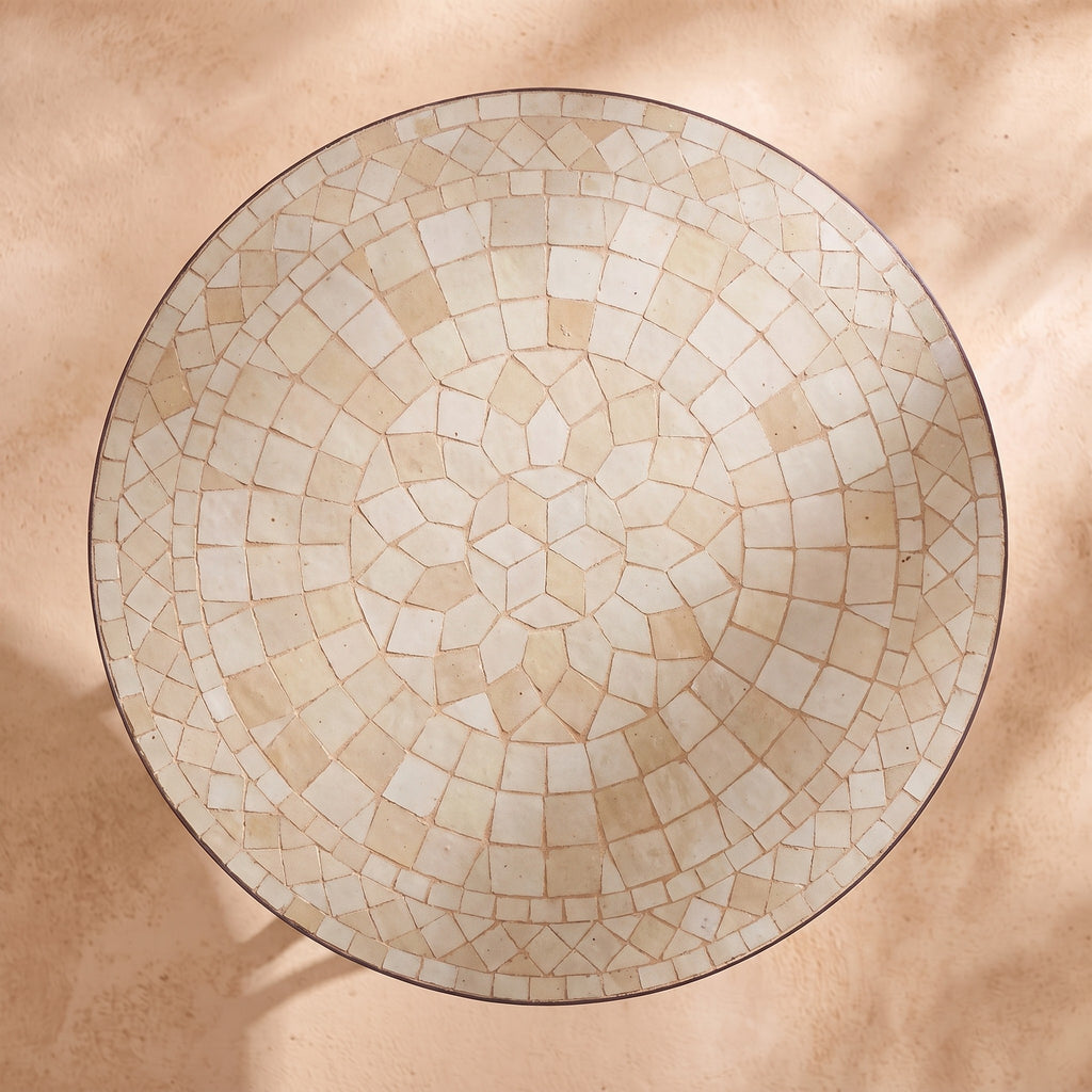 Semsem zellige mosaic side table seen from above, concentric rings of hand-cut tiles in cream, ivory and sand, colour rendering of the design