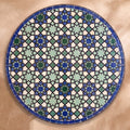 Sma zellige tabletop seen from above, Meknès outlined stars in cool blues and light green with black outlines