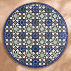 Sma zellige tabletop seen from above, Meknès outlined stars in cool blues and light green with black outlines