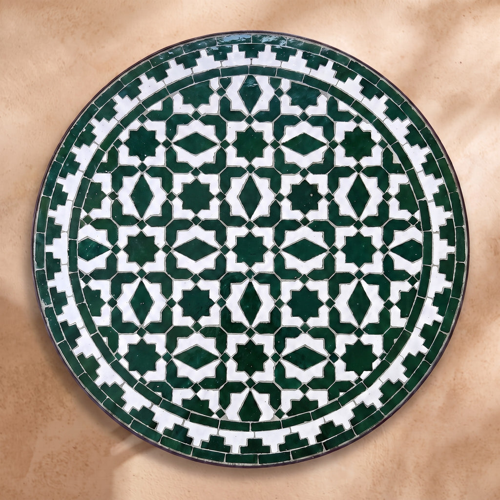 Zitoun zellige tabletop seen from above, Fez star lattice in green on white