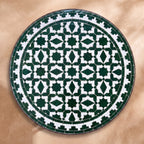 Zitoun zellige tabletop seen from above, Fez star lattice in green on white